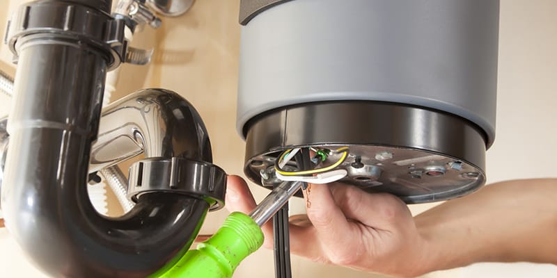 Greenfield, California plumber servicing water heater pipe connection