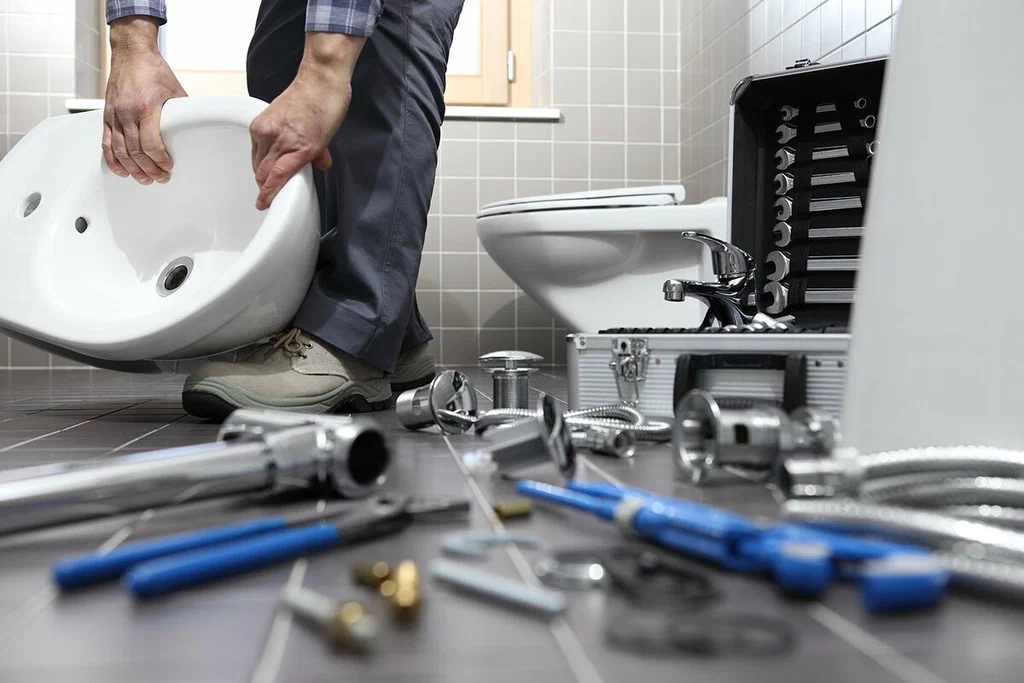 Plumbing tools prepared for a bathroom repair in Greenfield
